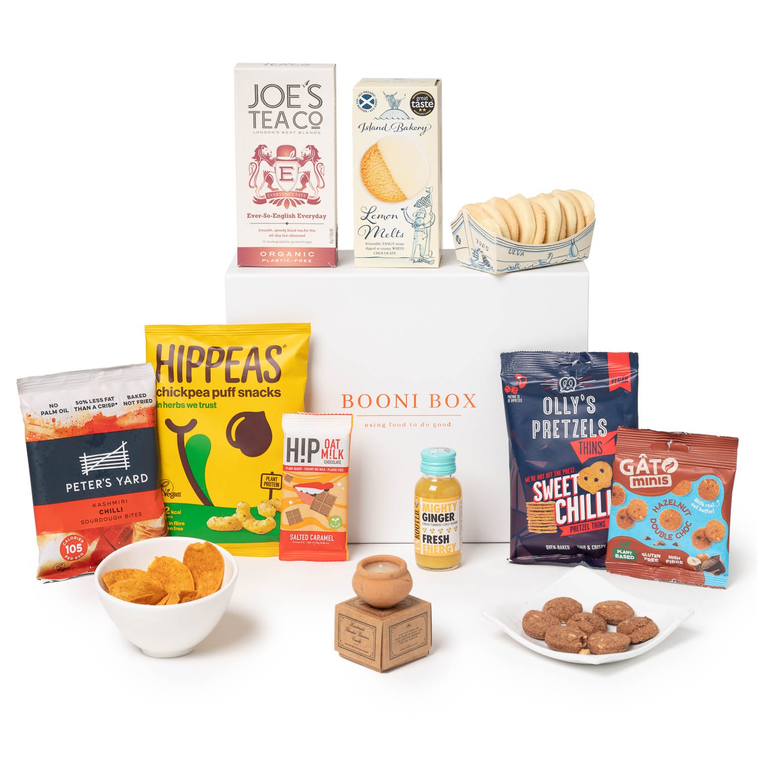 Booni Box with dalit candle, crisps, hippeas, chocolate, tea, biscuits, pretzels and ginger shot drink