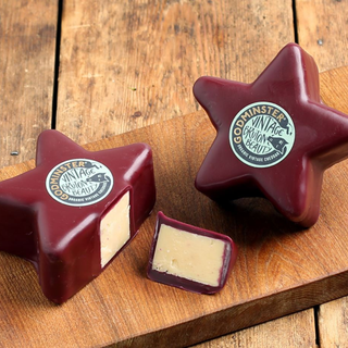 Godminster organic vintage cheddar in its burgundy wax star