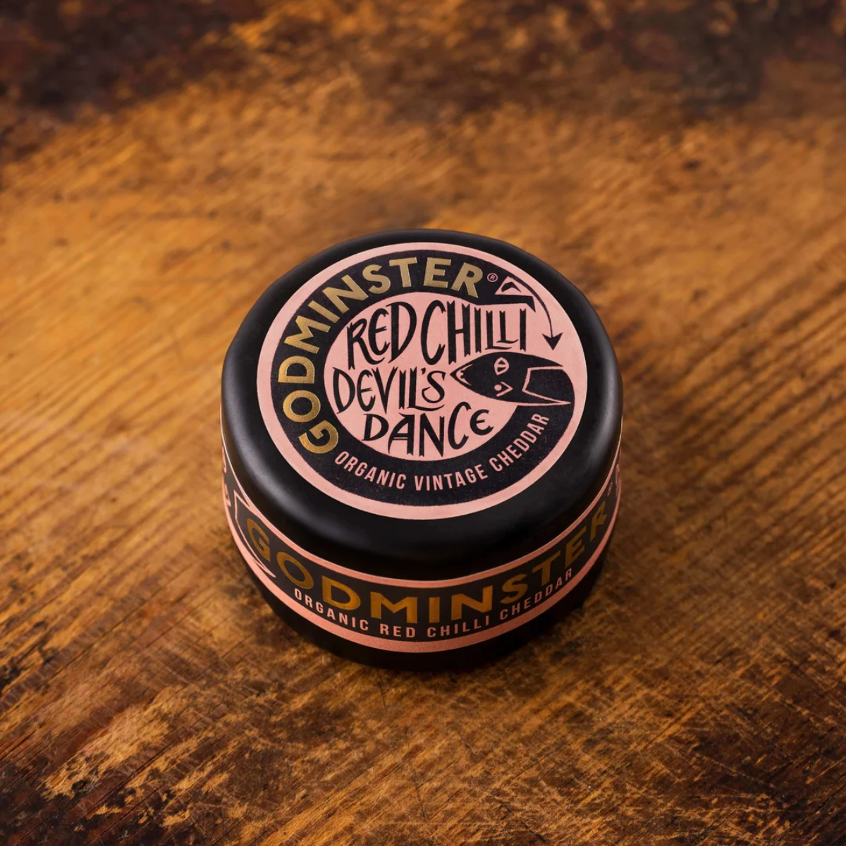 Godminster organic chilli cheddar sealed in a wax round