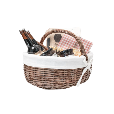 Wicker gift basket with white lining, used as a Booni Box gift container